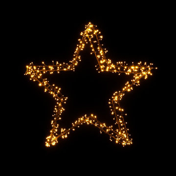 Merry Christmas star, warm light lamps garlands with little bulbs on black background, festive decorations. Glowing Christmas Lights star for Xmas Holiday Greeting Cards Design. reeting card design