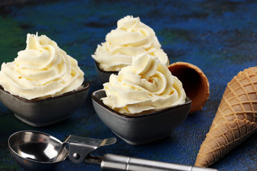 Vanilla soft served ice cream tasty sundae dairy ice cream on rustic background