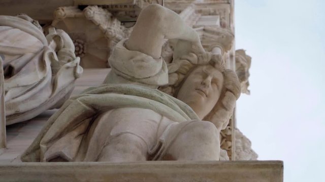 Statues and sculptures on the Duomo of Milan facade, Italy. Concept of classical artwork in Italy.