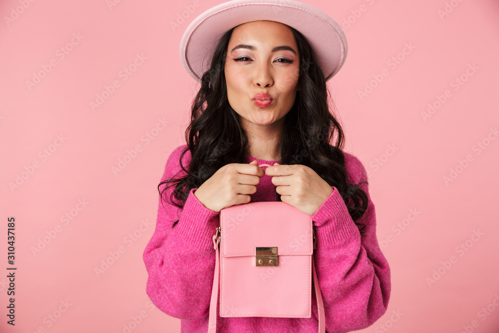 Canvas Prints Image of lovely beautiful asian girl wearing hat smiling and holding bag