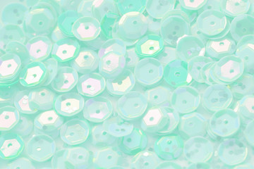 Mint color sequin mother of pearl festive background