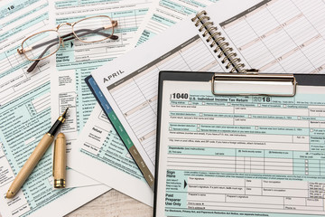 1040 individual us tax form with pen
