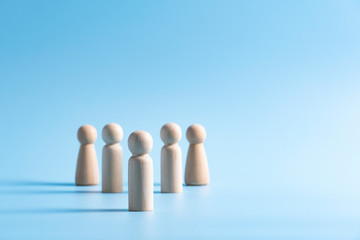 Outstanding people from crowd, group of teamwork wooden model, Leadership management concept