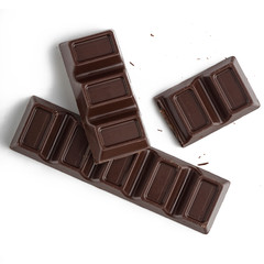 Pieces and cells of dark chocolate isolated on white
