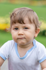 Little boy is playing on the grass