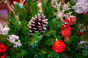 Christmas ball with decoration gift on pine tree