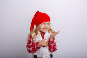 smiling little girl in Santa hat isolated on white background