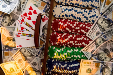 poker combination - card chips and money on the black table