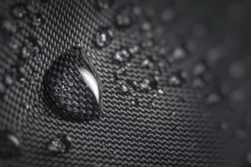 Badkamer foto achterwand Water drop on waterproof impregnated fabric of black umbrella during rain. © vchalup