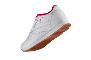 Sport shoes. White sneaker with red accents on a white background.