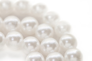 Necklace with nacrous white pearl isolated background macro