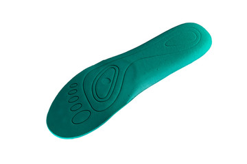 Green orthopedic insole on a white background