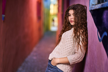 Young woman on a narrow old street