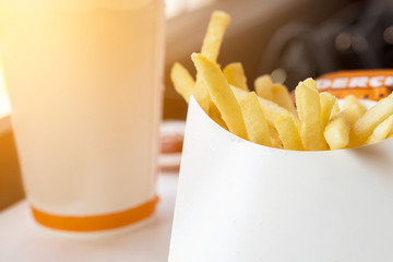 ฺฺClose up box of hot french fries at fast food restaurant.