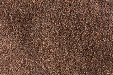 Background macro texture of suede brown leather.