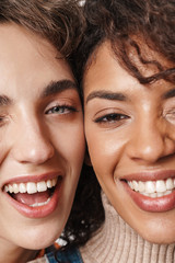 Positive smiling multiracial girls friends