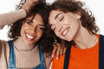 Optimistic two multiracial girls friends