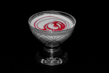 glass of wine on black background