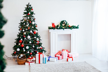 Christmas tree with Garland decoration and gifts for the new year