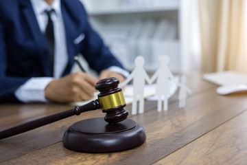 Family figure and gavel on table. Family law concept