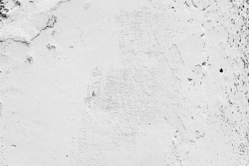 Texture of a concrete wall with cracks and scratches which can be used as a background