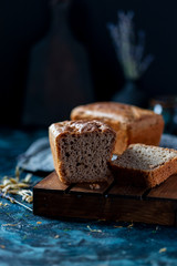 Sourdough bread. Sliced rye bread on a dark background. Healthy eating concept.