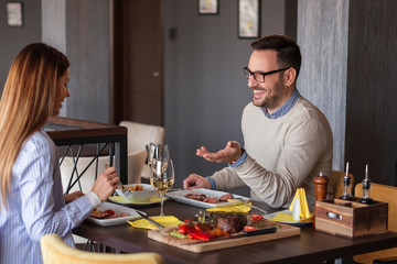 Couple eating dinner in restaurant