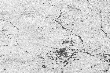 Texture of a concrete wall with cracks and scratches which can be used as a background