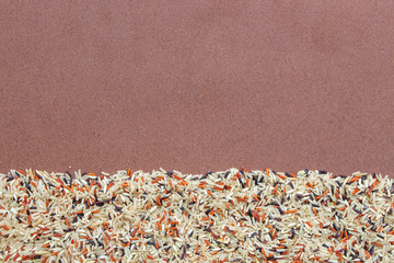organic riceberry, red jasmine rice and brown rice (hommali rice) on wooden background 02