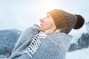 Portrait Happy woman traveler on the snowy of mountain look on t