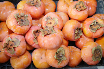 Ripe organic persimmon fruit. Persimmon pattern.