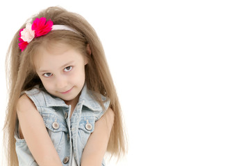 Little girl hugging her knees.