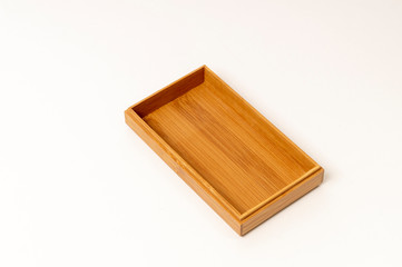 open wooden box on white background close up