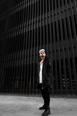 Obraz premium brutal guy in the black on a black background