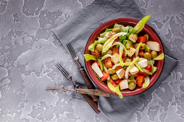 Vegetarian mix salad with grapefruit, avocado, lettuce, olives and smoked cheese. Top view. Copy space