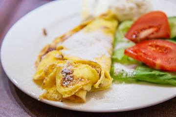 omelet with ham tomato and green salad