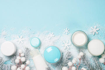 Natural cosmetics for winter on blue.