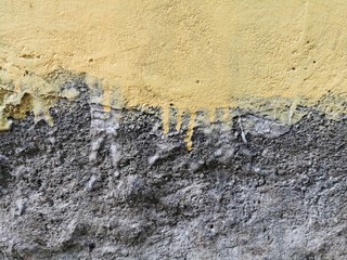 wall texture for background and wallpaper. Cement wall background with yellow and dark grey color