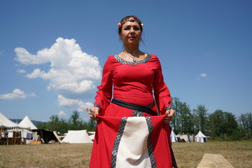 Woman in medieval robes photographed at a festival in Germany