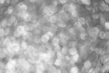 Silver abstract bokeh background. Silver Christmas texture.