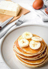cooked pancake on plate at wooden background