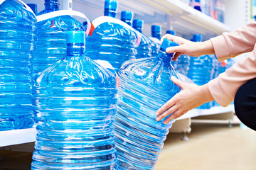 Bottles of drinking water for dispenser in store