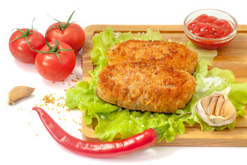 Juicy grilled meat cutlet close-up on a background of fresh vegetables on a white background. Photo for the menu or recipe.