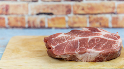 Pork tenderloin, sliced ​​on a stick, prepared for cooking