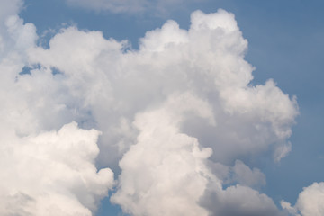 Towering cumulus cloud formation. Summer cloudy blue sky. 
