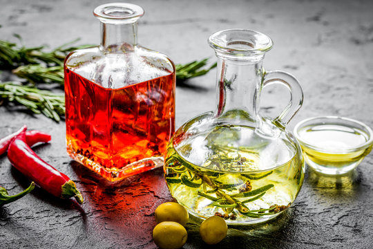 natural oils concept with fresh olives and chili paper on table background