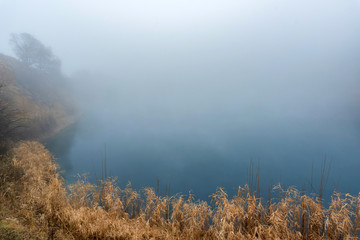 Beautiful view of foggy Shadhurey lake in autumn Russia