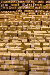 Piles of cardboard boxes at distribution warehouse