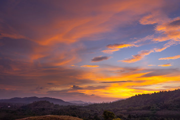 Obraz na płótnie Canvas A beautiful twilight sky on top of mountain.