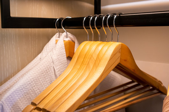 wooden hanger in wardrobe